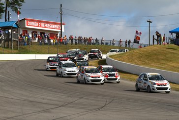 Intense battles during the first race, won by Xavier Coupal